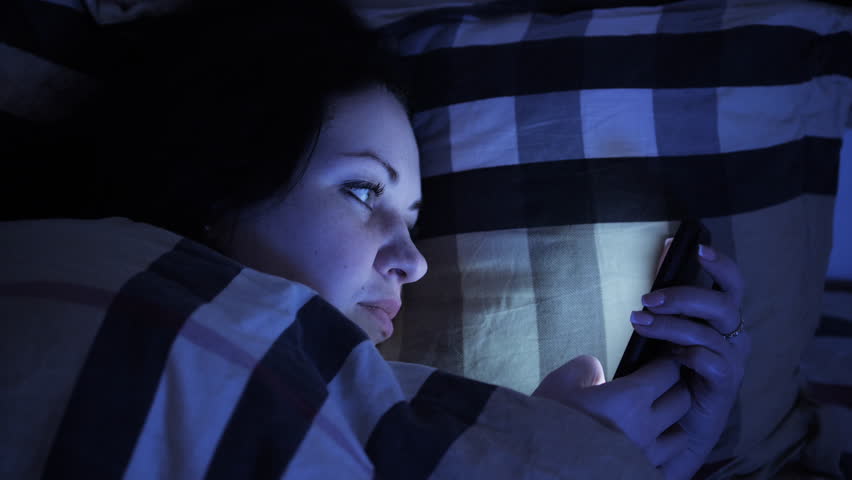 Woman has insomnia, can not sleep, worrying about problems, looking at phone Royalty-Free Stock Footage #1025809901
