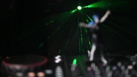 Dj club concept. Woman DJ mixing, and Scratching in a Night Club. Girl silhouette on dj's deck, strobe lights and fog on background. Creative artwork decoration with toy. Selective focus - Powered by Shutterstock - Get 15% off with code: PIKWIZARD15