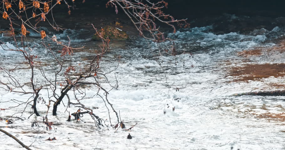 White mountain stream water falling down. Bursting ecology background
