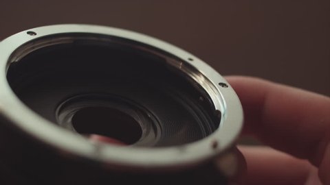 Close-up of the opening and closing of the lens aperture.