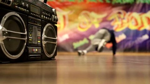 breakdance and hip hop dancer on graffiti boombox background