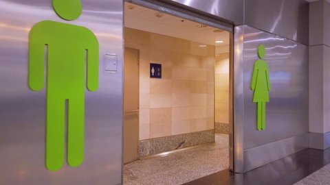Buenos Aires / Argentina: CIRCA February 2019: Airport Toilets entrance - Gimbal walking shoot - Men and women restrooms doors