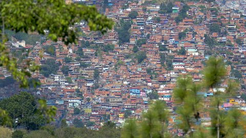 Panning view of architectural chaos in poverty zones, Caracas, Venezuela. With a population of more than 4 million people is a sprawling metropolis choked with traffic and violence.