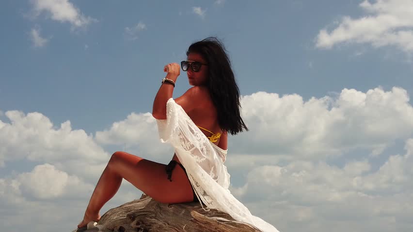 Classy fashion woman sunbathing on the tropical beach summer travel holidays