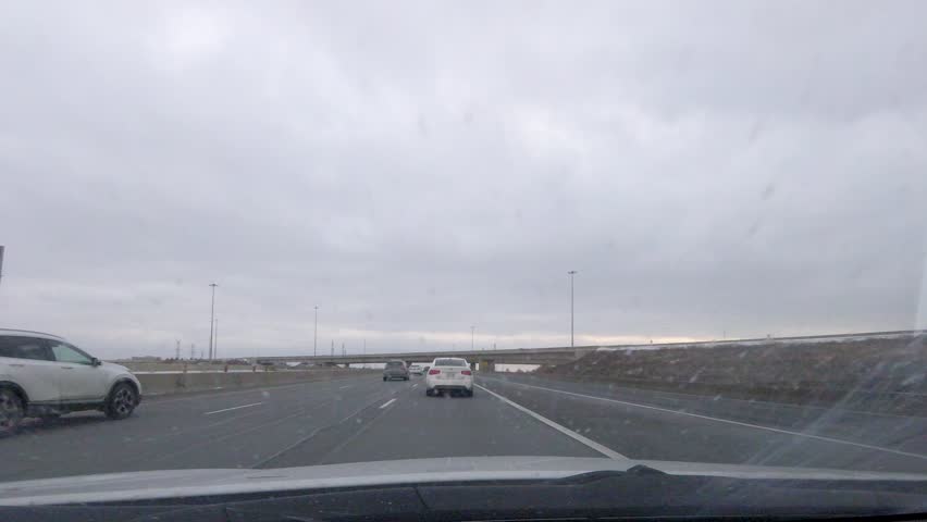 Traveling highway 401, the most traveled highway in North America, on a cloudy afternoon