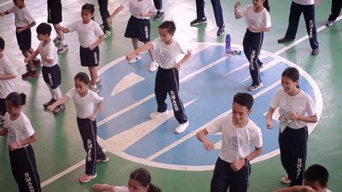 Cebu City, Philippines /March /2019 Kids doing karate exercise on their PE uniform