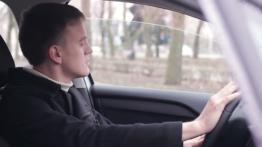 Driver listening to music in the car and dancing while sitting | Shutterstock HD Video #1025874290