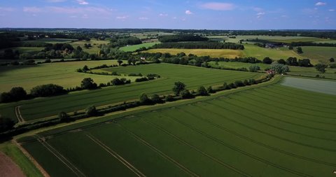 A hot summers British countryside in the county of Hertfordshire with an aerial view of farming fields.