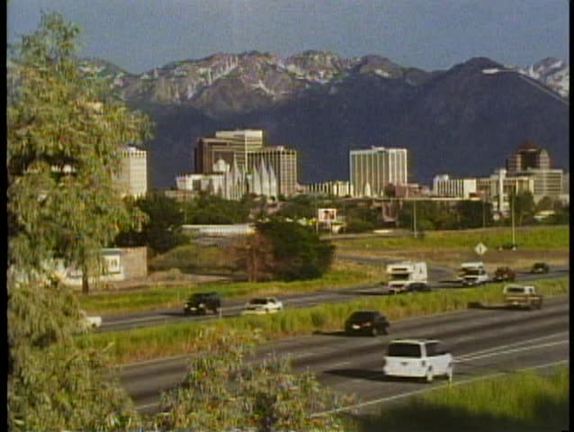 SALT LAKE CITY, UTAH, 1994, Skyline, mountains and interstate highway with cars