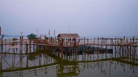 4K video of Kwan Phayao lake with bamboo bridge in the evening, Thailand.