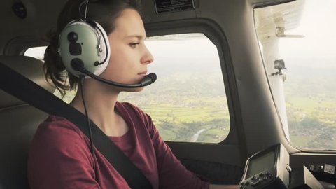 Female pilot flying through heavy turbulence