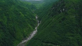 4K hd aerial drone top down shot, green mountain, river stream falling down from hill, idyllic place, in Tunca Valley, Ardesen, Rize Province, Turkey