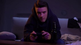Parents catching teen son drinking beer and playing video game, rebellious age