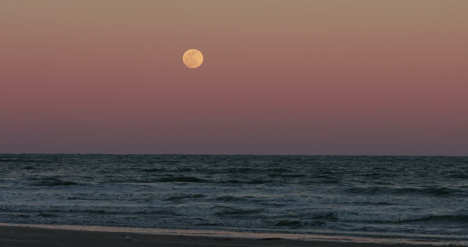 Full moon over night surf Gulf of Mexico Texas. Beautiful southern Texas, Gulf of Mexico Ocean beach. Padre Island, Mustang Island, Corpus Christi.  Waves and surf on sand. Royalty-Free Stock Footage #1025927216