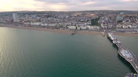 Aerial video of an epic sunset over the coast of Brighton in the UK