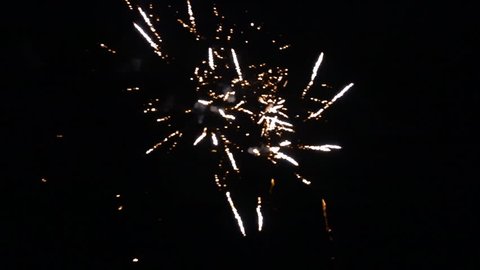 Firework at New Years evening. Slow motion with lots of sparkles at the end.