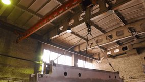 Industrial concept. A crane lifting on a big iron detail - Powered by Shutterstock - Get 15% off with code: PIKWIZARD15