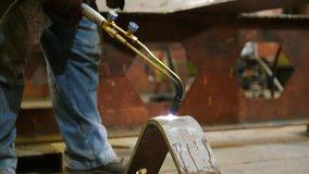 Industrial concept. A man heating up an iron detail - Powered by Shutterstock - Get 15% off with code: PIKWIZARD15