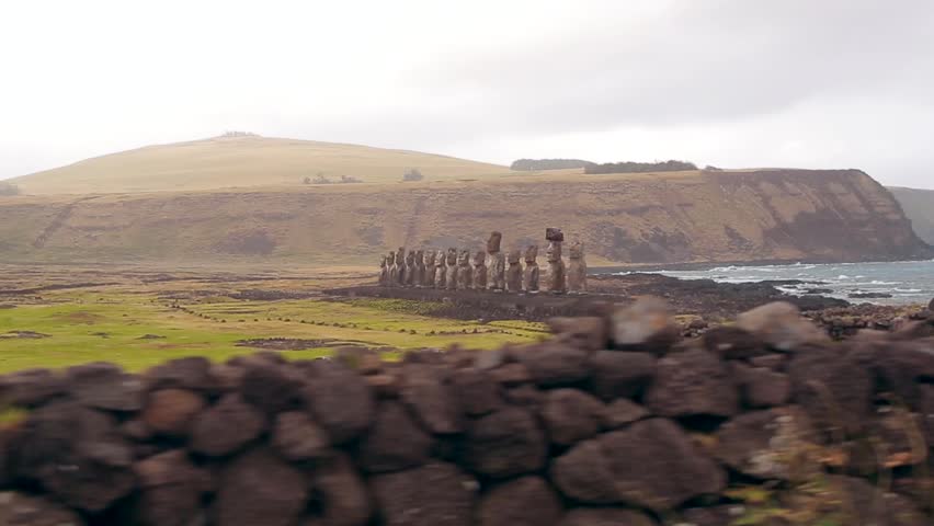 AHU TONGARIKI, EASTER ISLAND, CHILE. Fifteen idols placed on a large flat stone platform with a seaward vertical wall. The Moai statues face away from the sea.