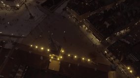 Aerial view of the Old city night Warsaw with the square and the royal palace in the night lighting. Drone shot 4k. Video format RAW.