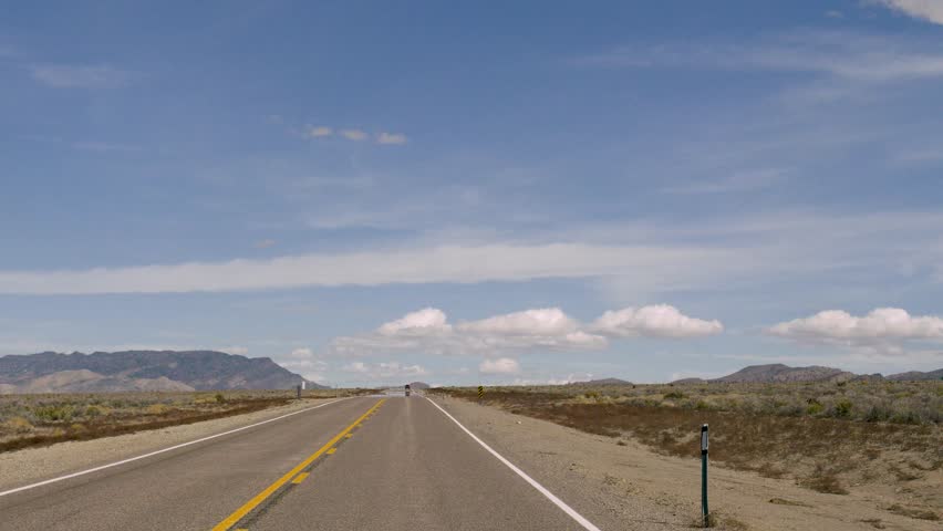 Drive plate-Long straight 2-lane road through Nevada desert along US Highway 93, the Great Basin Highway-POV