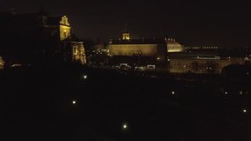 4k. Aerial view of the Old city night Warsaw with the square and the royal palace in the night lighting. Drone shot  Video format RAW.