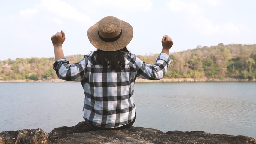 Woman hipster traveller enjoying with nature