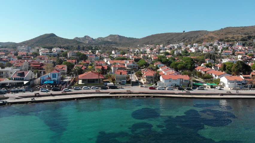 Various drone shots in beautiful Urla, Izmir - the third largest city in Turkey. Blue waters of the Aegean Sea, seagulls and sailboats on a sunny summer morning/afternoon.