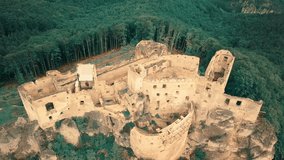 landscape view on castle in field on the mountains background in summer sunny day with blue sky, Drone 4K Video