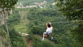 Man and child having fun moving on zip line above big canyon - Powered by Shutterstock - Get 15% off with code: PIKWIZARD15