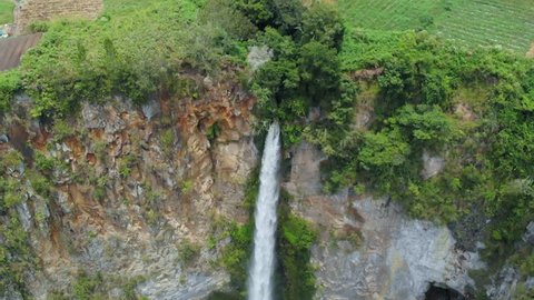 Aerial slow motion: Sipiso-piso waterfall in Sumatra, travel destination in Berastagi and Lake Toba, Indonesia. 