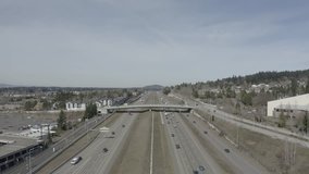 I-205 Freeway running along side Clackamas Town Center showing mid day traffic north and south bound lanes