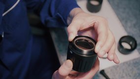 hand with photography lens and cleaning tools on a service desk - Powered by Shutterstock - Get 15% off with code: PIKWIZARD15