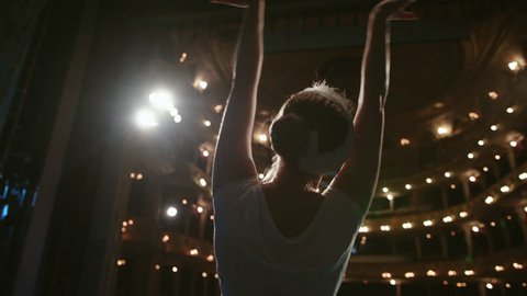 Young Ballet Dancer Performing On Stage In A Large Theater.
