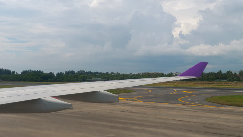 View of runway airport of Phuket, from taxiing airplane