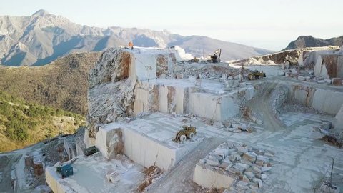Marble quarry of Carrara. Aerial of the mountain with blocks and excavators.