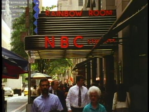 NEW YORK CITY, 1994, NBC Marquee at Rockefeller Center, people pass