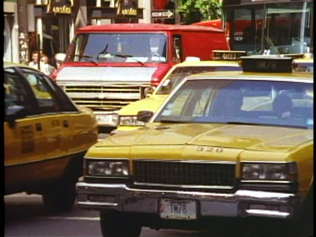NEW YORK CITY, 1994, Taxicabs on Fifth Avenue bunched together, busy