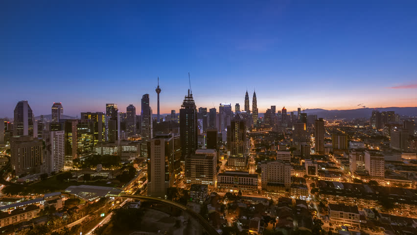 Time lapse: Kuala Lumpur city view during dawn overlooking the city skyline in Federal Territory, Malaysia. Royalty-Free Stock Footage #1026016247