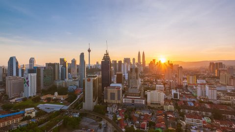 Time lapse: Kuala Lumpur city view during dawn overlooking the city skyline in Federal Territory, Malaysia.