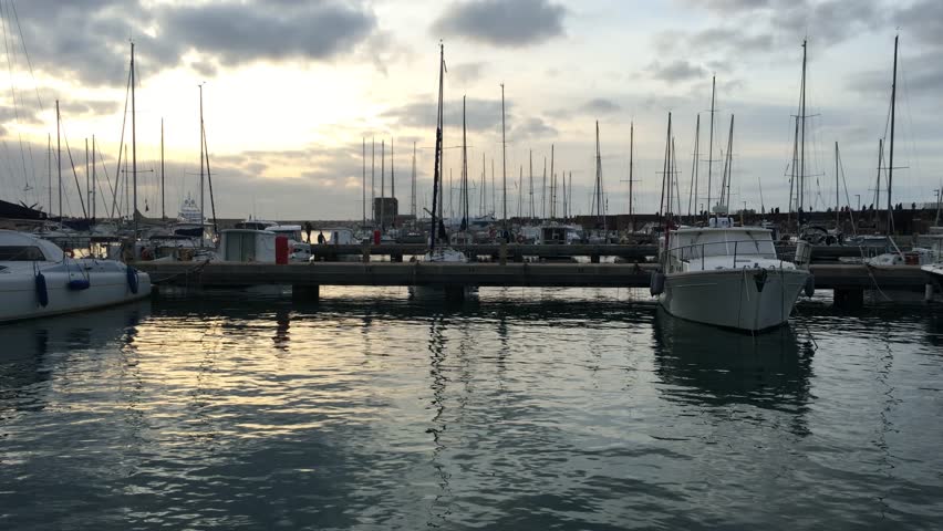horizontal walking shot of an Italian touristic harbor