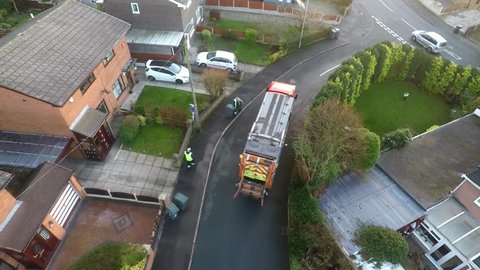 January 201, Aerial View, footage of Dustmen putting recycling waste into a garbage truck, Bin men, refuse collectors. bin lorry, Recycling day