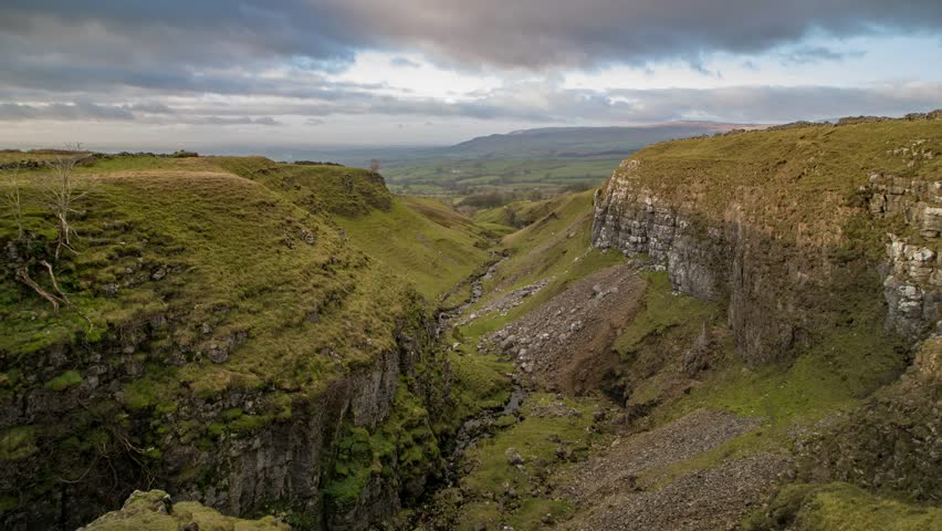 Time-lapse footage as the light fades looking down Mousegill Beck with the Eden Valley and the North Pennines in the background, Cumbria UK.