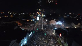 Beautiful starry fireworks and city light in Yogyakarta monument or TUGU JOGJA sky during new year celebration