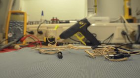Electronics engineer testing and repairing electronic cables in his workshop - accelerated video