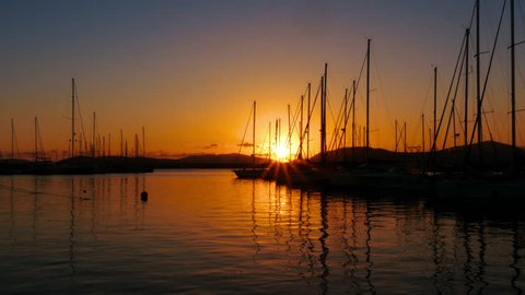 Alghero, Sardinia / Italy - June 17th, 2015: Alghero marina at sunset. 