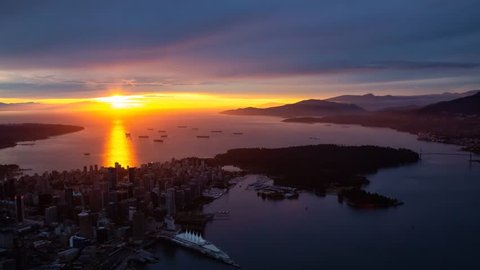 Aerial view of Downtown City during a striking and dramatic sunset. Taken in Vancouver, British Columbia, Canada. Still Image Continuous Animation