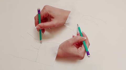 Drawing hands: two hands are shown, each drawing the other (tribute to Escher). Looped video 4k, motion photo.