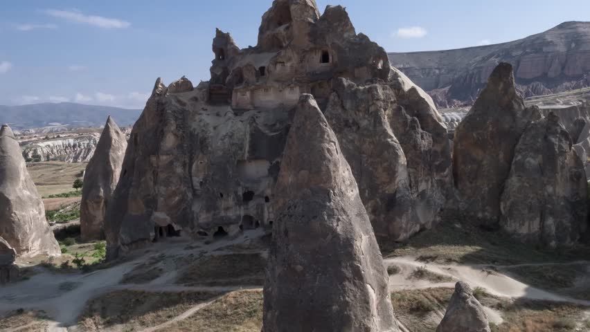 Aerial photography from drone, flight between the mountains of Cappadocia, Goreme. Landscape Panaroma. Aerial view. Turkey 4k