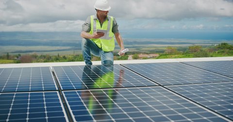 Sustainable green energy jobs, solar panel technician working with solar panels